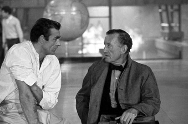 Sean Connery and author Ian Fleming discuss the character of James Bond while filming an interior scene for "Dr No" at Pinewood Studios. Copyright Notice - © 1962 Danjaq, LLC and United Artists Corporation. All rights reserved