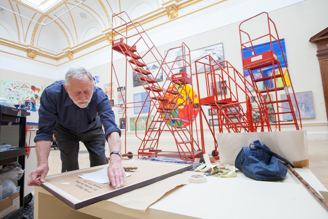 Peter Freeth RA, installing the Summer exhibition 2013. Photo: Benedict Johnson